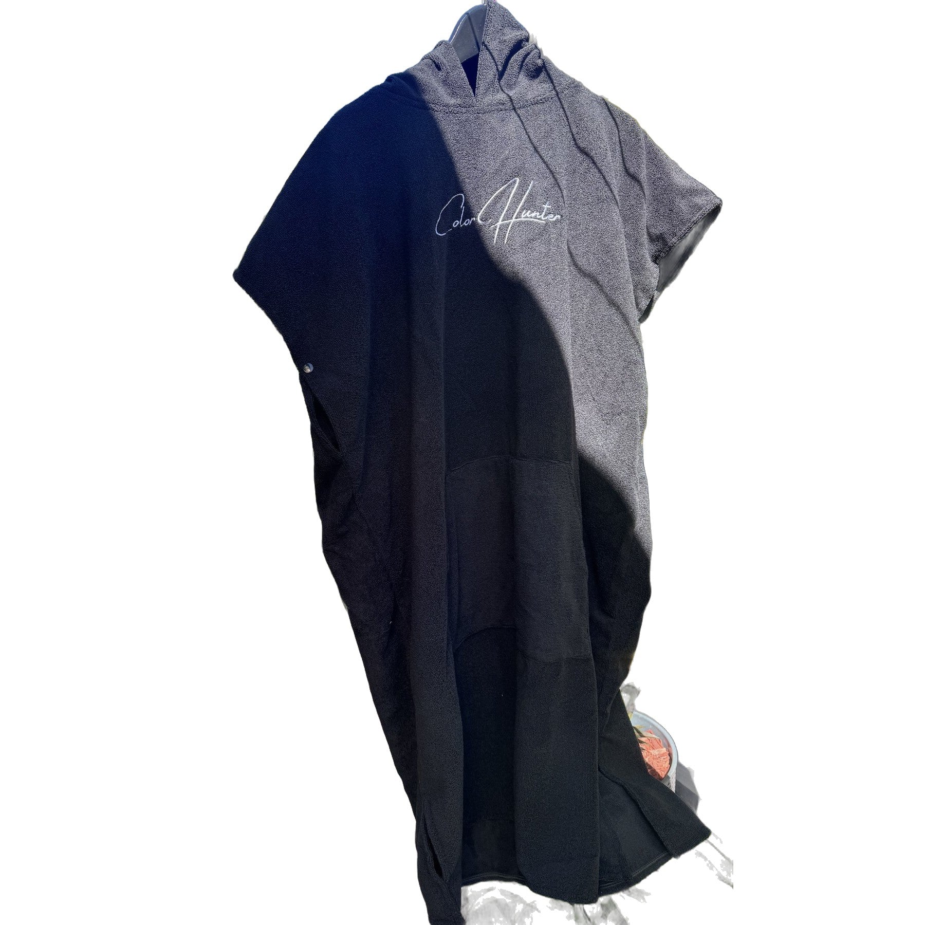 Color Hunter black hooded surf changing poncho, angled view