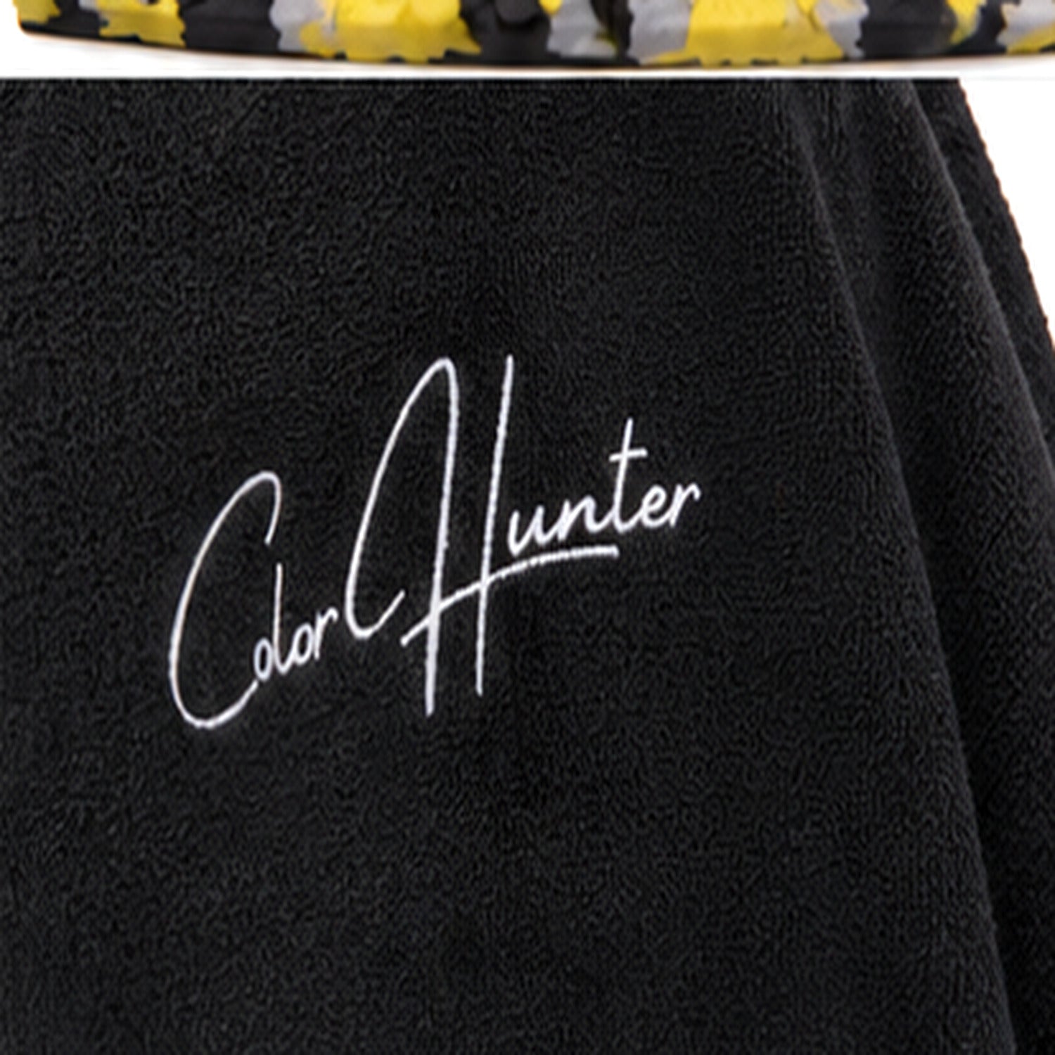 Color Hunter logo embroidered on black fleece poncho - detail