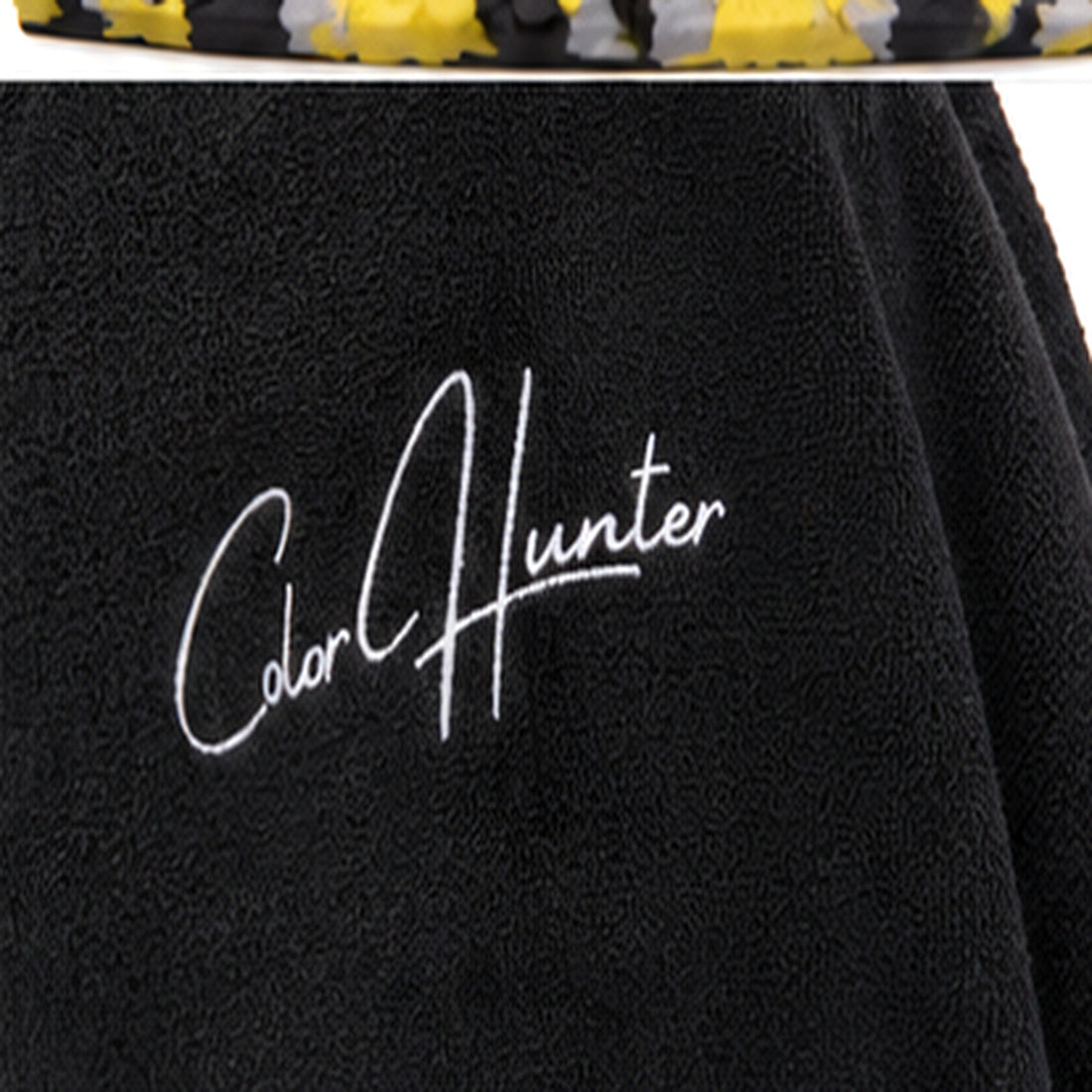 Color Hunter logo embroidered on black fleece poncho - detail
