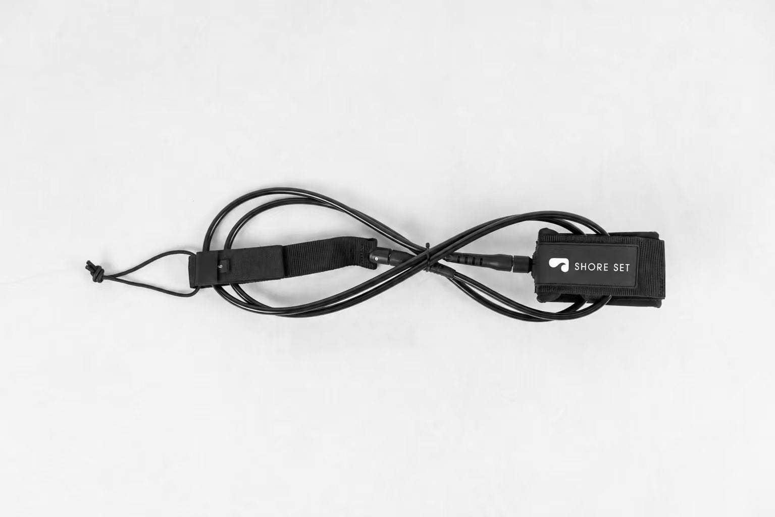 Close-up of Shoreset leash cuff and PVC logo label